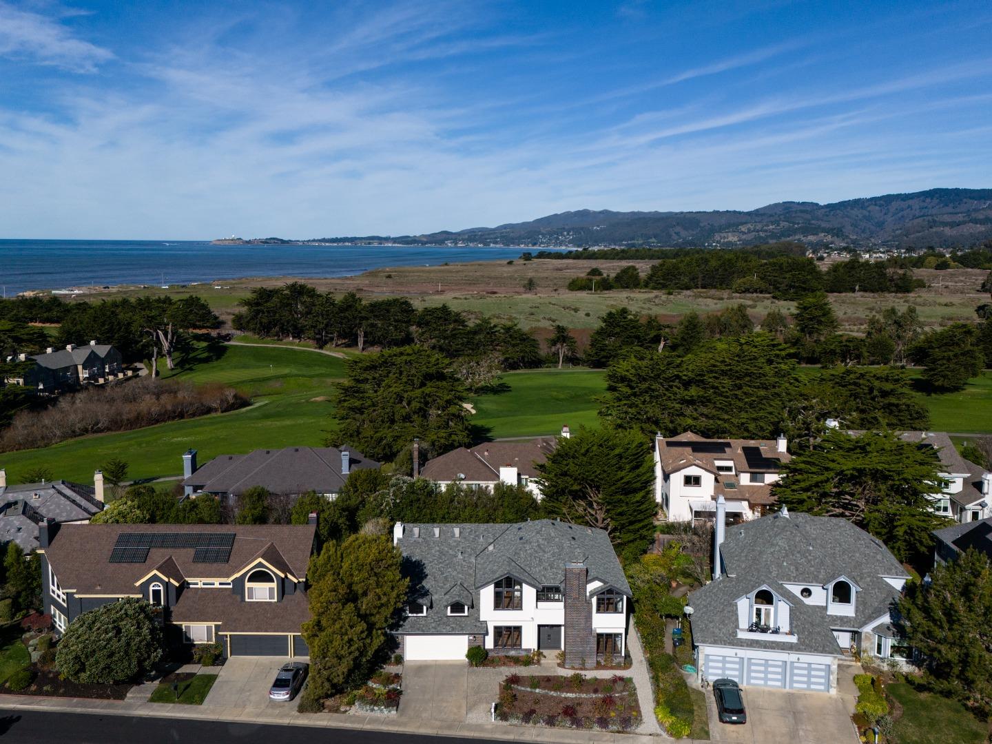 11 Fairway Place Half Moon Bay, CA 94019 - Photo 2 of 42 an aerial view of a city with lots of residential buildings ocean and mountain view in back