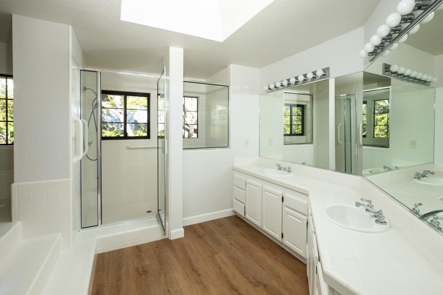 11 Fairway Place Half Moon Bay, CA 94019 - Photo 31 of 42 a spacious bathroom with a tub sink and mirror