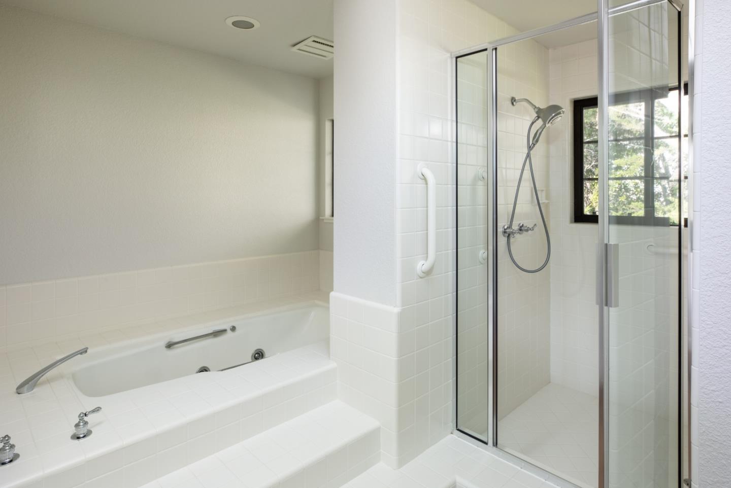 11 Fairway Place Half Moon Bay, CA 94019 - Photo 32 of 42 a bathroom with a tub sink shower and mirror