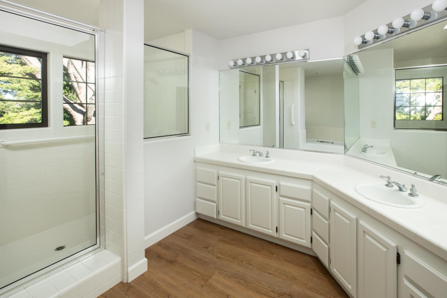 11 Fairway Place Half Moon Bay, CA 94019 - Photo 34 of 42 a spacious bathroom with a double vanity sink mirror and shower