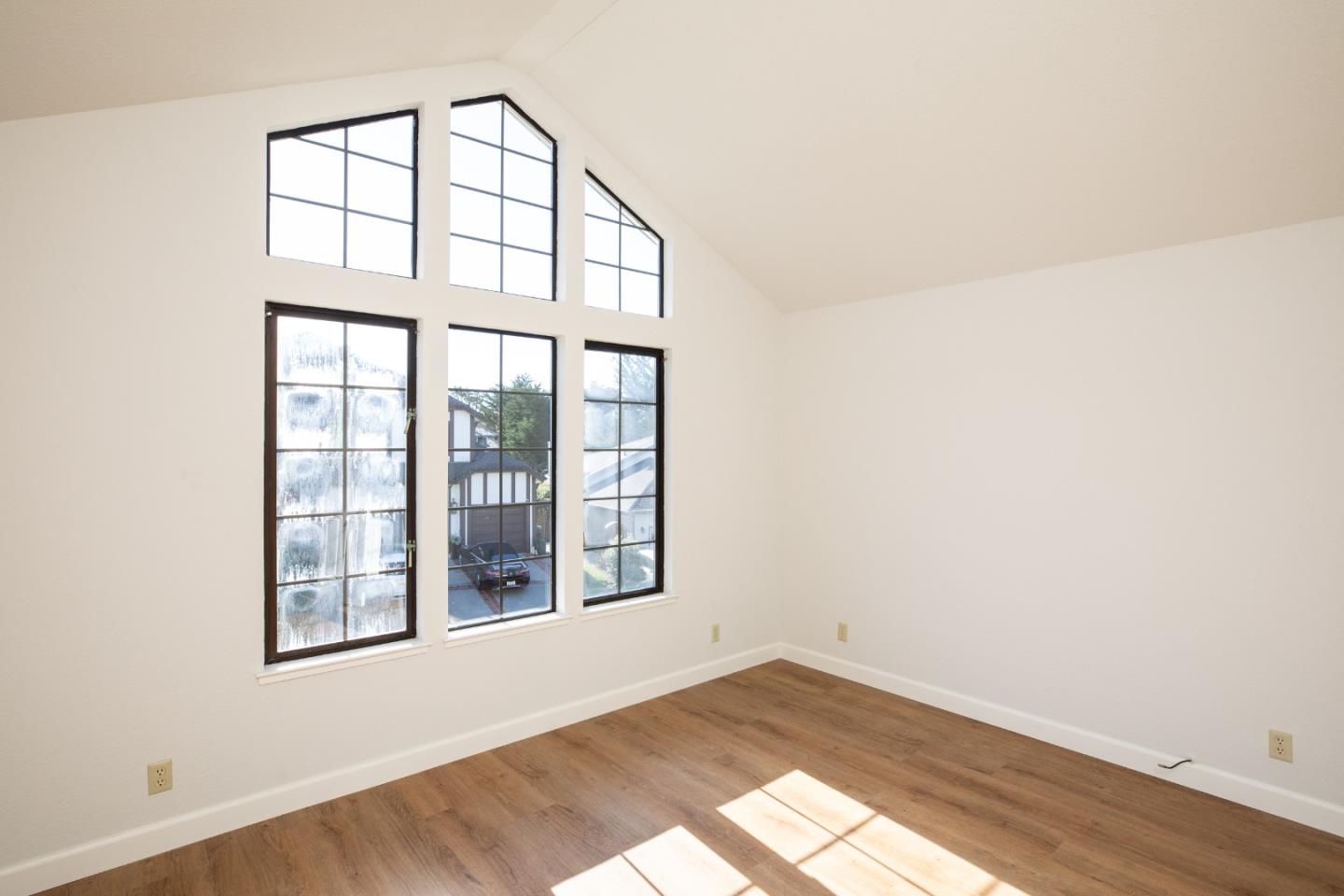 11 Fairway Place Half Moon Bay, CA 94019 - Photo 37 of 42 a view of an empty room with wooden floor and a window