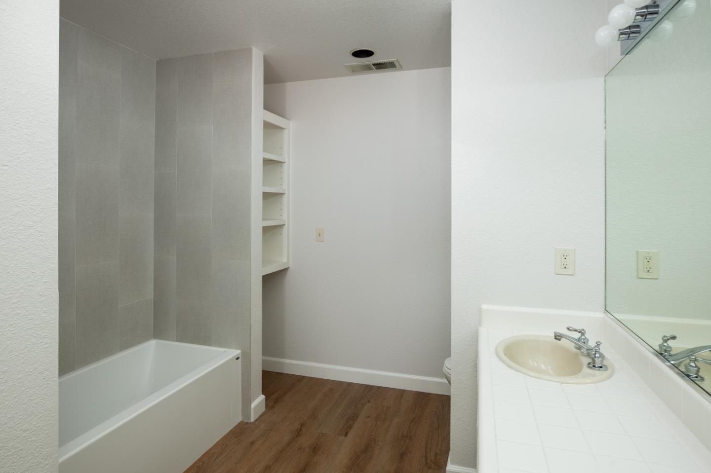 11 Fairway Place Half Moon Bay, CA 94019 - Photo 41 of 42 a bathroom with a tub sink and mirror
