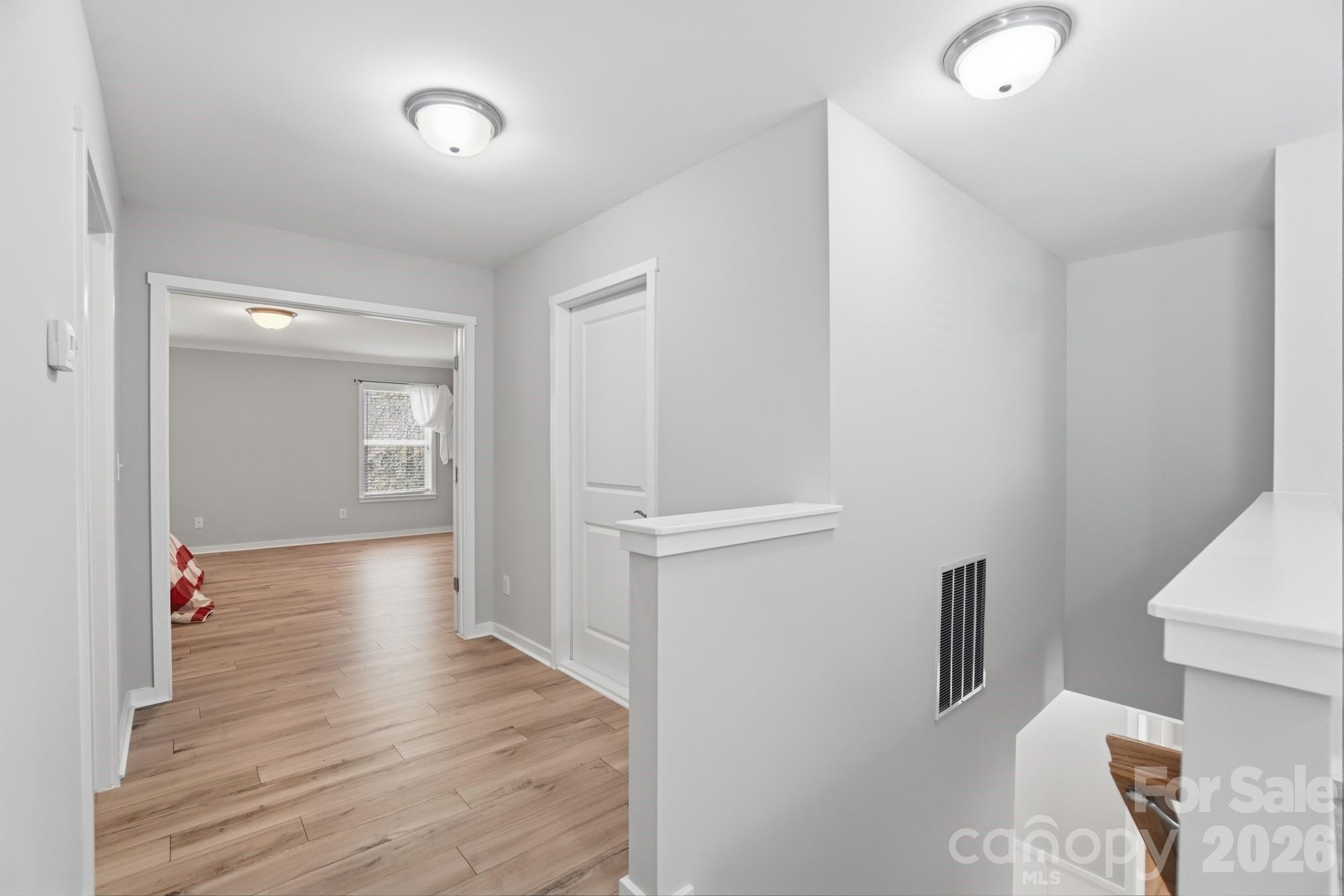 2153 Bluebell Way Tega Cay, SC 29708 - Photo 26 of 48 a view of empty room with wooden floor