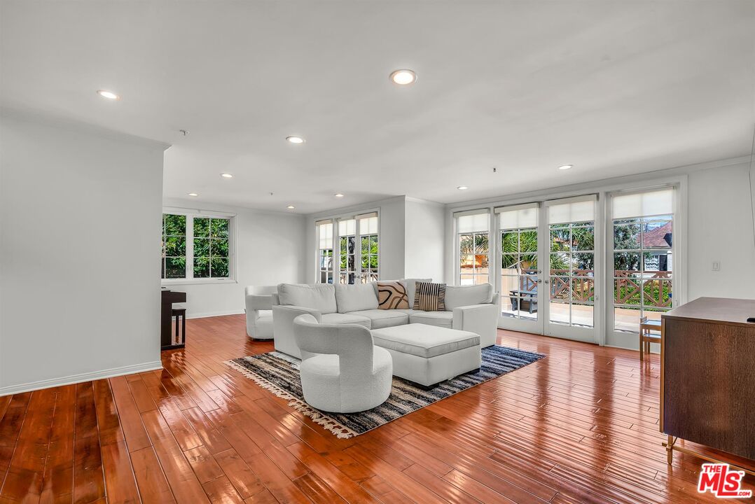 10555 Ashton Avenue, Unit 201 Los Angeles, CA 90024 - Photo 1 of 33 a living room with fireplace furniture and a wooden floor