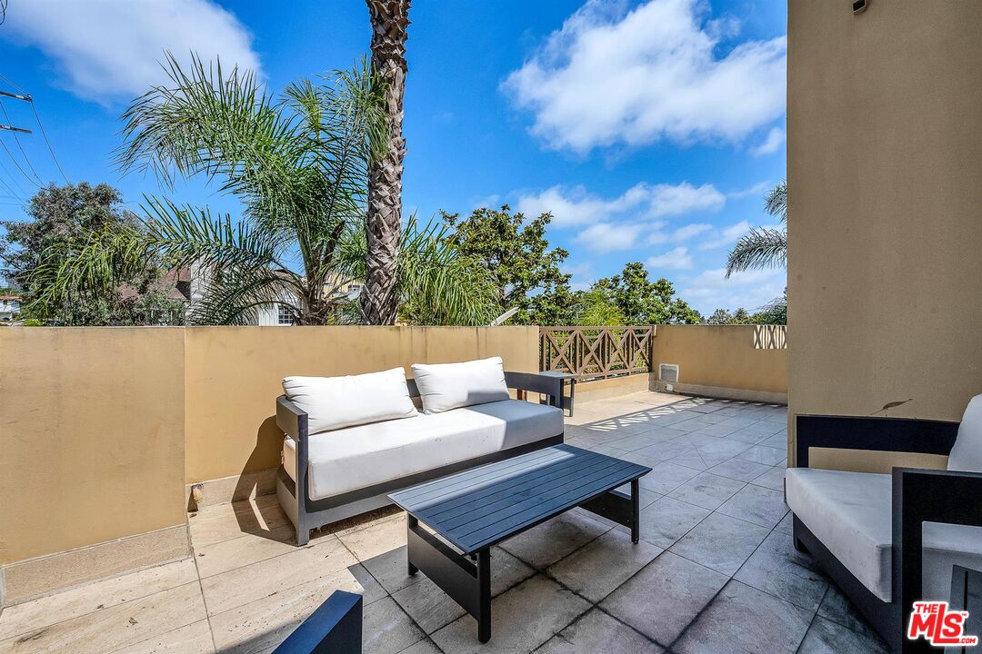10555 Ashton Avenue, Unit 201 Los Angeles, CA 90024 - Photo 11 of 33 a outdoor living space with furniture and a potted plant