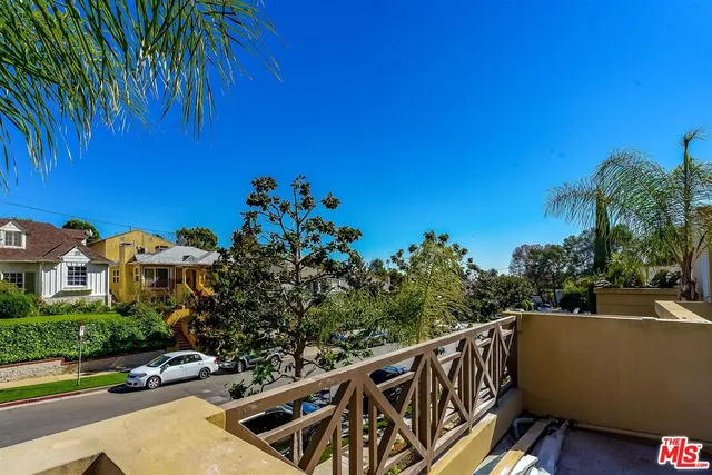 a view of balcony with furniture