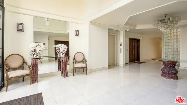a view of a livingroom with furniture and staircase