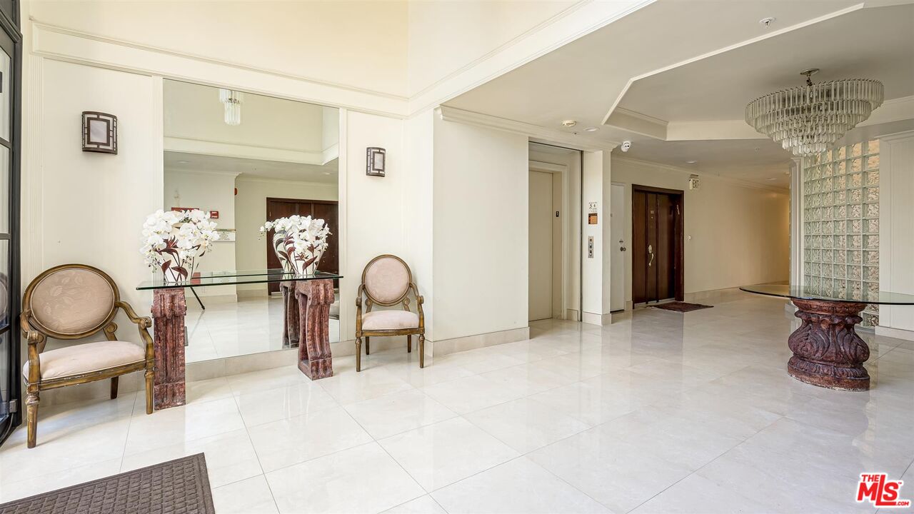 10555 Ashton Avenue, Unit 201 Los Angeles, CA 90024 - Photo 2 of 33 a view of a livingroom with furniture and staircase