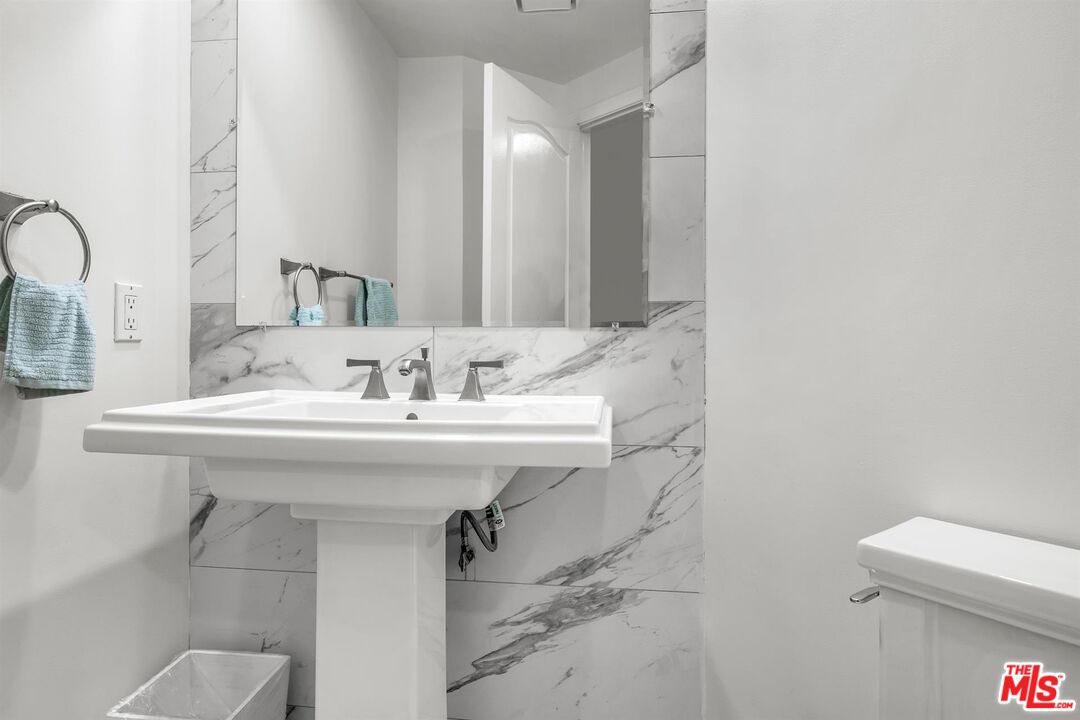 10555 Ashton Avenue, Unit 201 Los Angeles, CA 90024 - Photo 31 of 33 a bathroom with a sink and a toilet