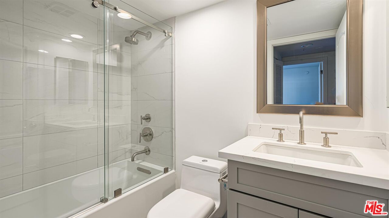 10555 Ashton Avenue, Unit 201 Los Angeles, CA 90024 - Photo 32 of 33 a bathroom with a sink toilet and shower