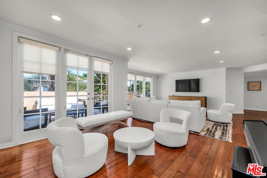 10555 Ashton Avenue, Unit 201 Los Angeles, CA 90024 - Photo 5 of 33 a living room with furniture and a large window