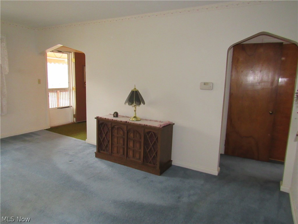 120 North 3rd Street Rittman, OH 44270 - Photo 19 of 25 The formal living room features charming arched doorways!