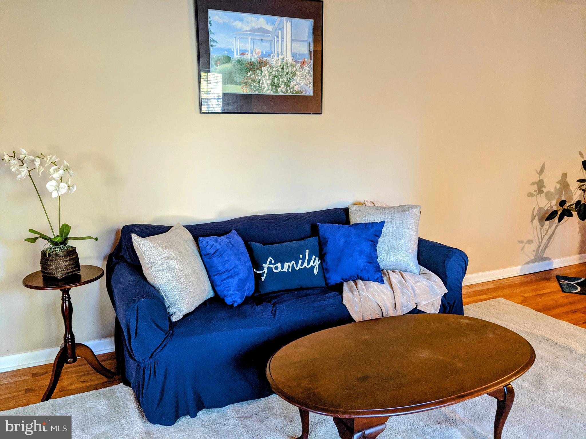 1342 Calvert Road Chester, MD 21619 - Photo 20 of 29 a living room with furniture and a lamp