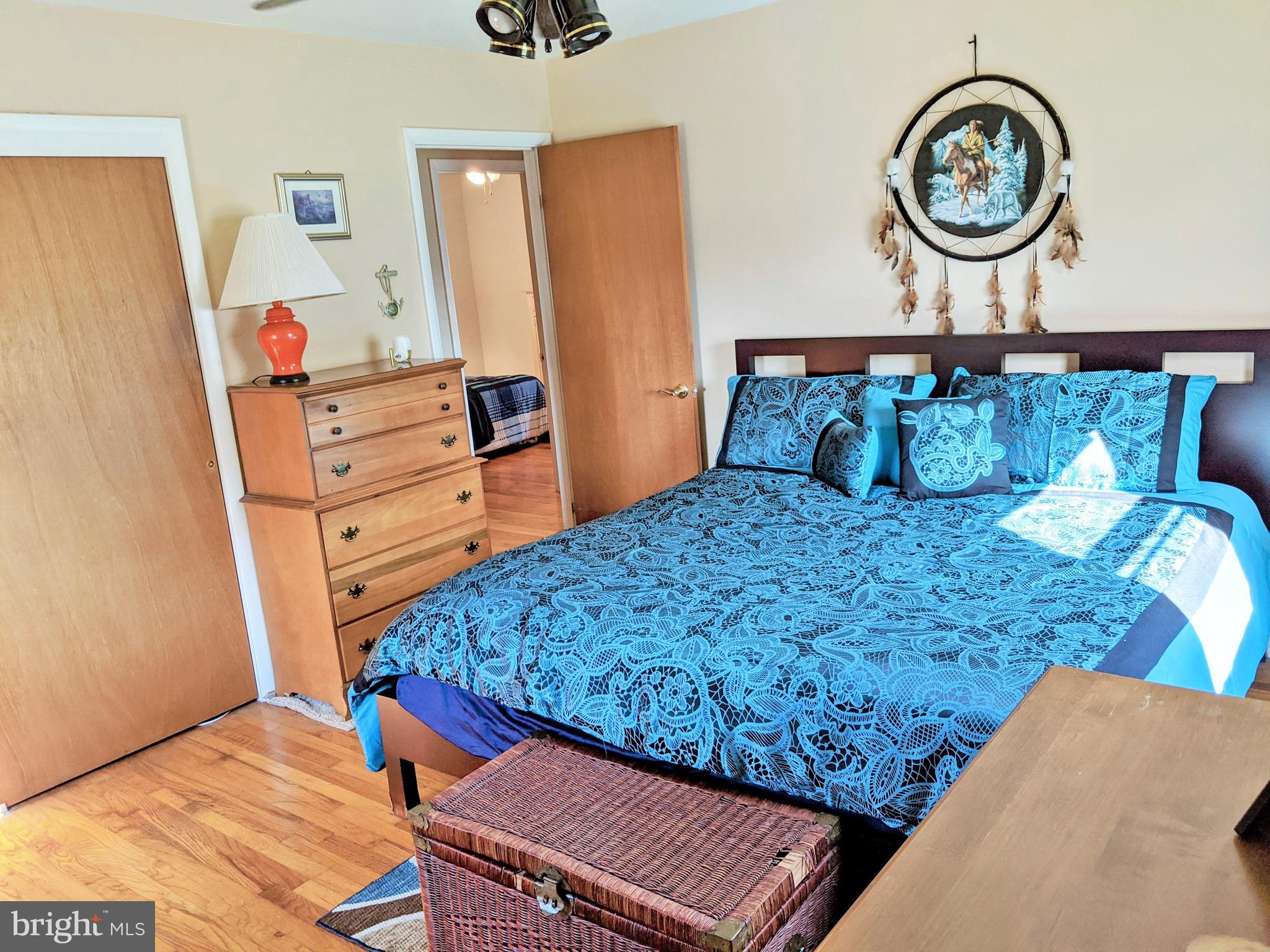 1342 Calvert Road Chester, MD 21619 - Photo 22 of 29 a bed sitting in a bedroom next to a window