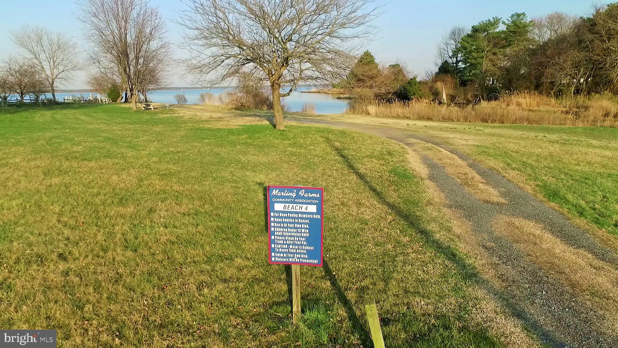 1342 Calvert Road Chester, MD 21619 - Photo 28 of 29 a sign board with yard in the back