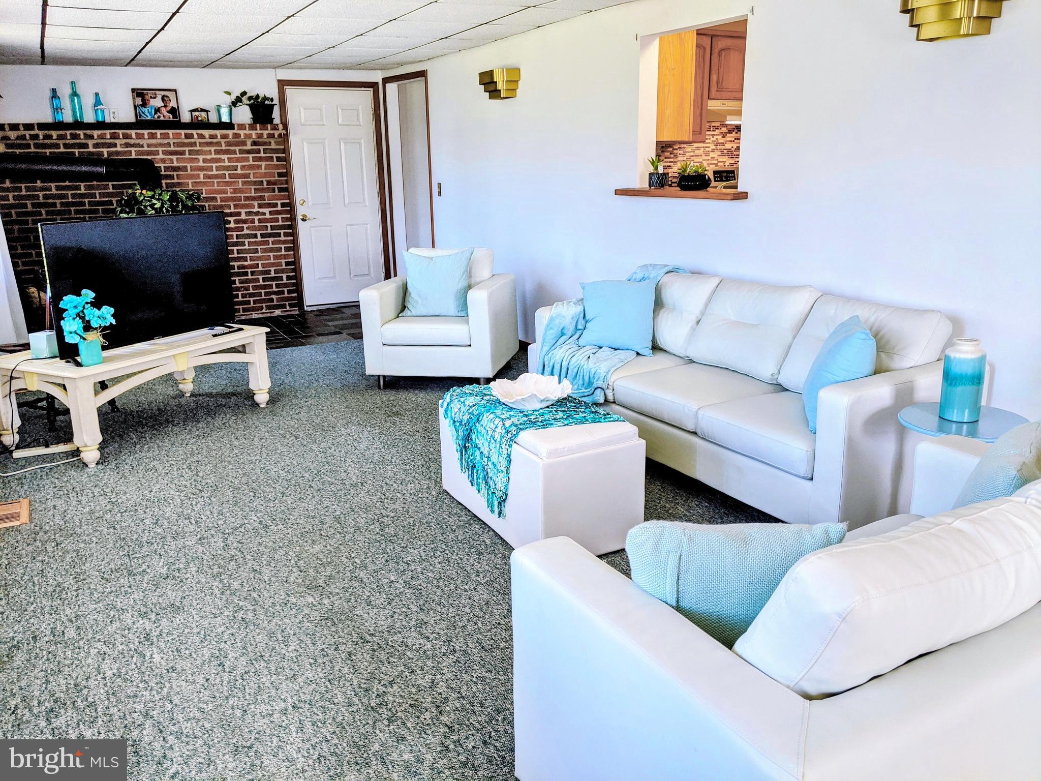 1342 Calvert Road Chester, MD 21619 - Photo 4 of 29 a living room with furniture and a couch