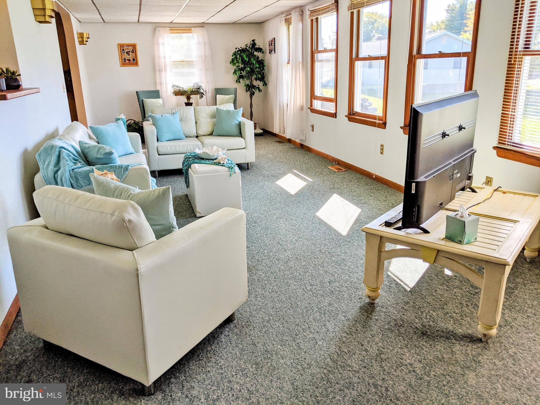 1342 Calvert Road Chester, MD 21619 - Photo 7 of 29 a living room with furniture and a gate