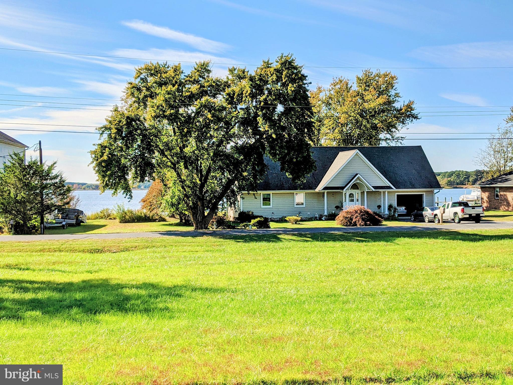 1342 Calvert Road Chester, MD 21619 - Photo 10 of 29 a front view of house with yard and swimming pool