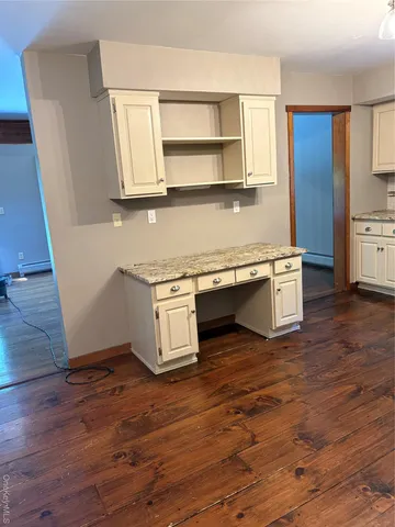 a kitchen with stainless steel appliances granite countertop a sink and a stove top oven