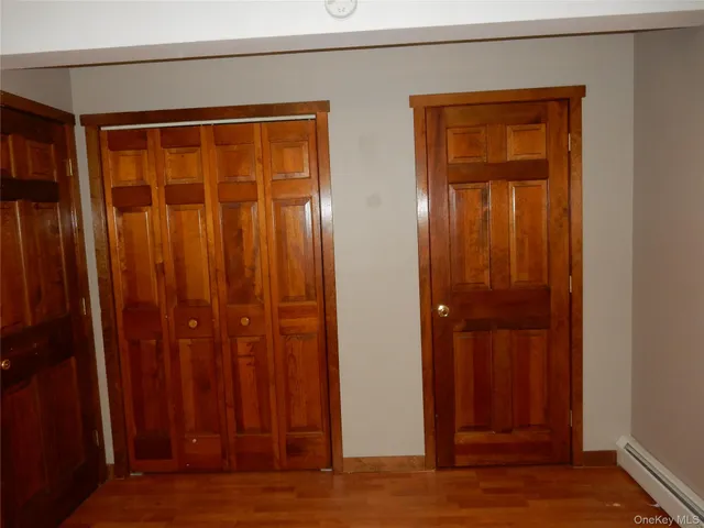 an empty room with closet area
