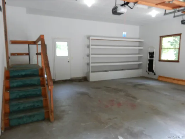 a view of room with stairs and a window