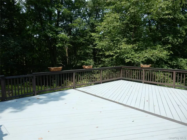 a view of balcony with wooden floor