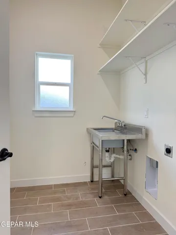 a view of a room that has a table and chair in it