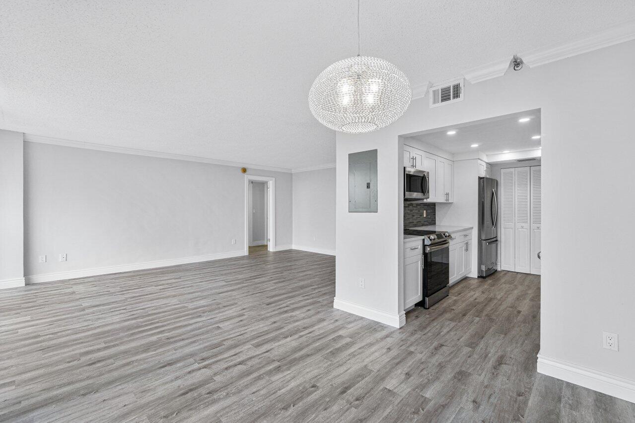 859 Jeffery Street, Unit 609 Boca Raton, FL 33487 - Photo 17 of 34 living room to kitchen