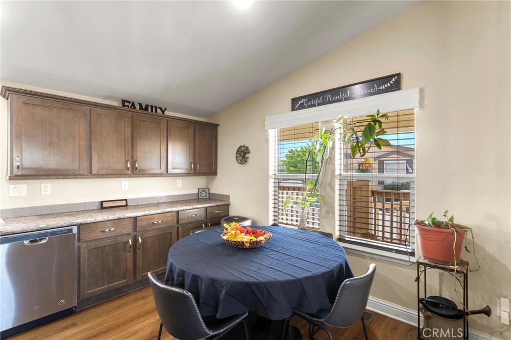 22241 Nisqually Road, Unit 103 Apple Valley, CA 92308 - Photo 11 of 34 Dining area with natural light and window views