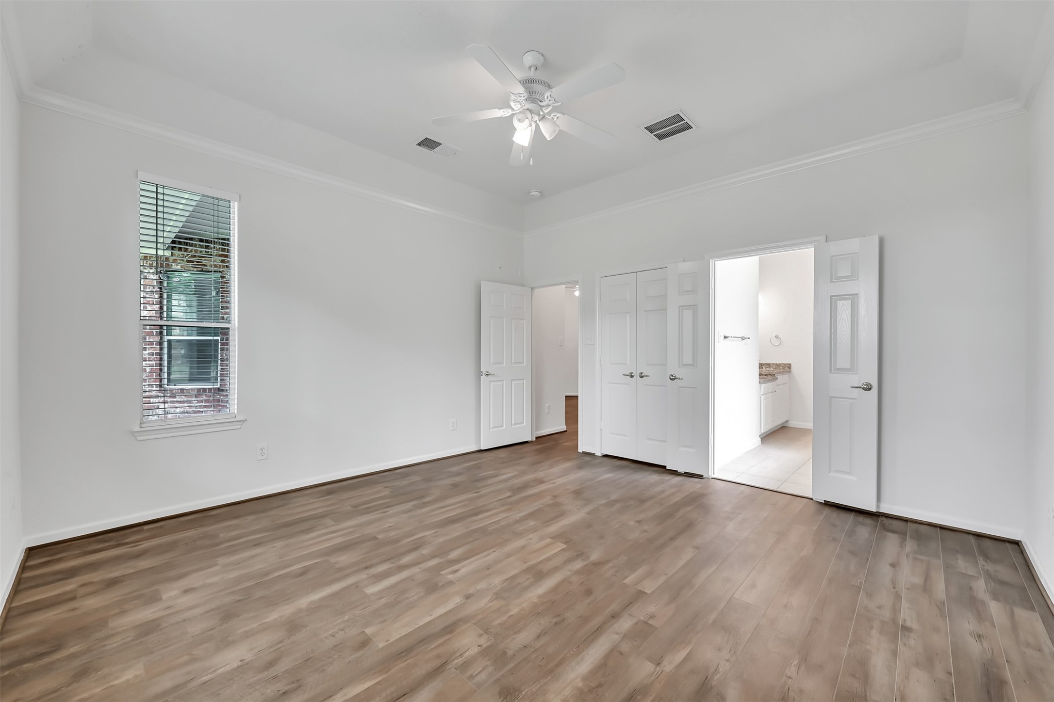 47 Presidio Road Montgomery, TX 77356 - Photo 16 of 35 a view of an empty room with wooden floor and a window