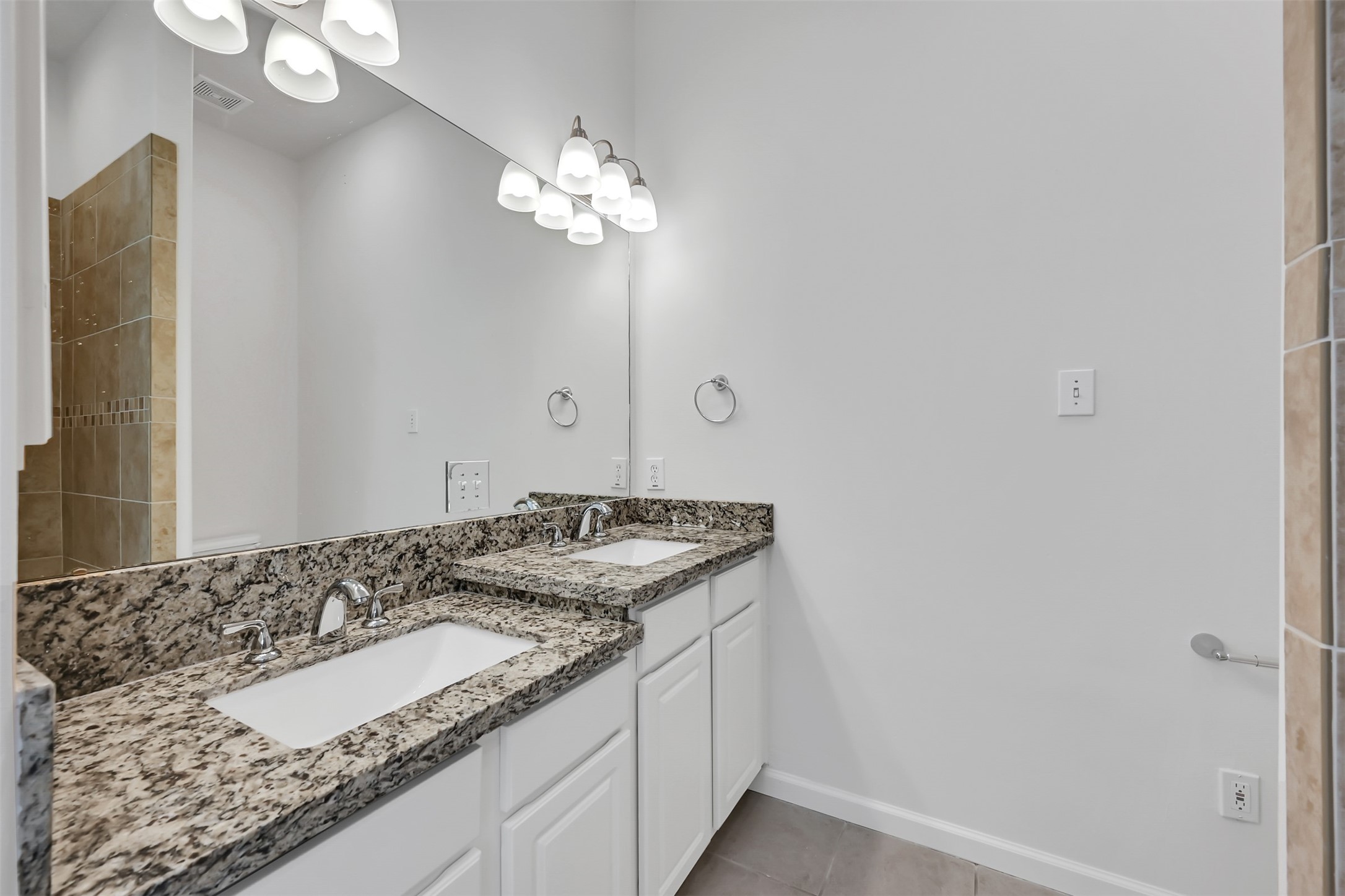 47 Presidio Road Montgomery, TX 77356 - Photo 17 of 35 a bathroom with a granite countertop sink and a mirror