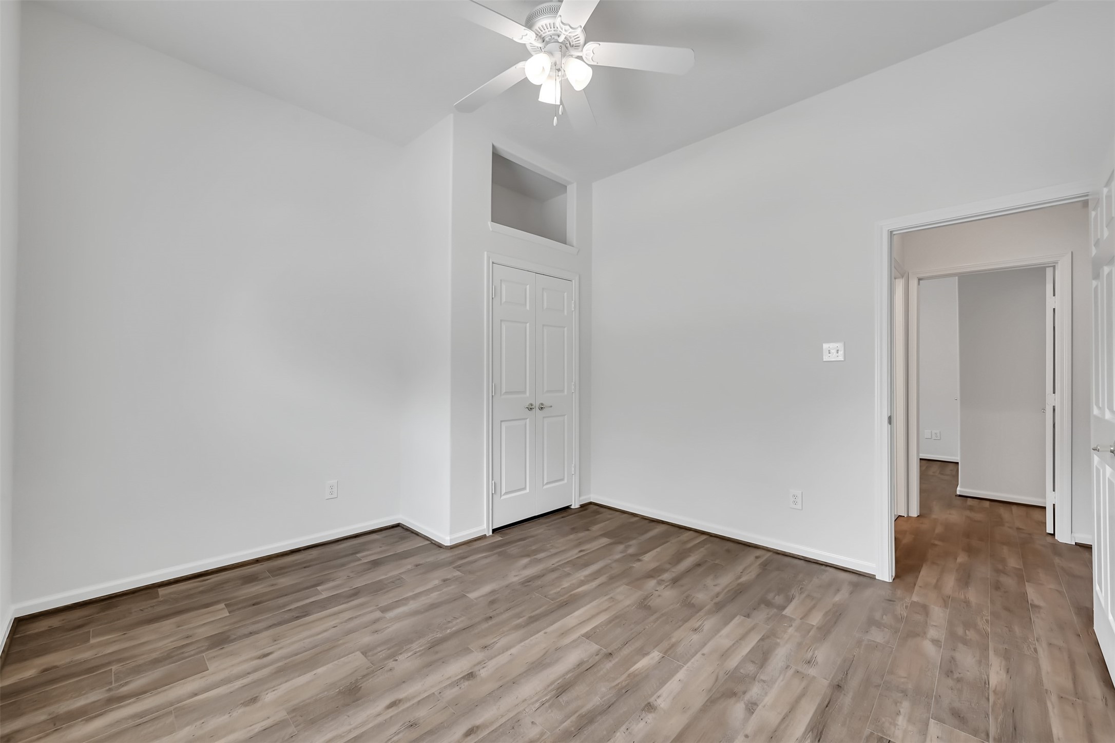 47 Presidio Road Montgomery, TX 77356 - Photo 19 of 35 a view of a room with wooden floor and ceiling fan