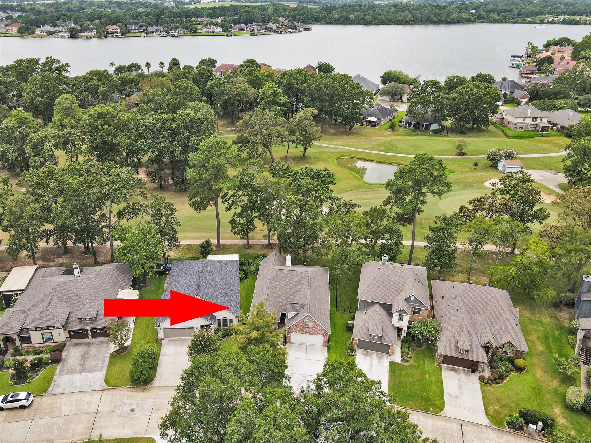 47 Presidio Road Montgomery, TX 77356 - Photo 34 of 35 an aerial view of a house with a yard and lake view
