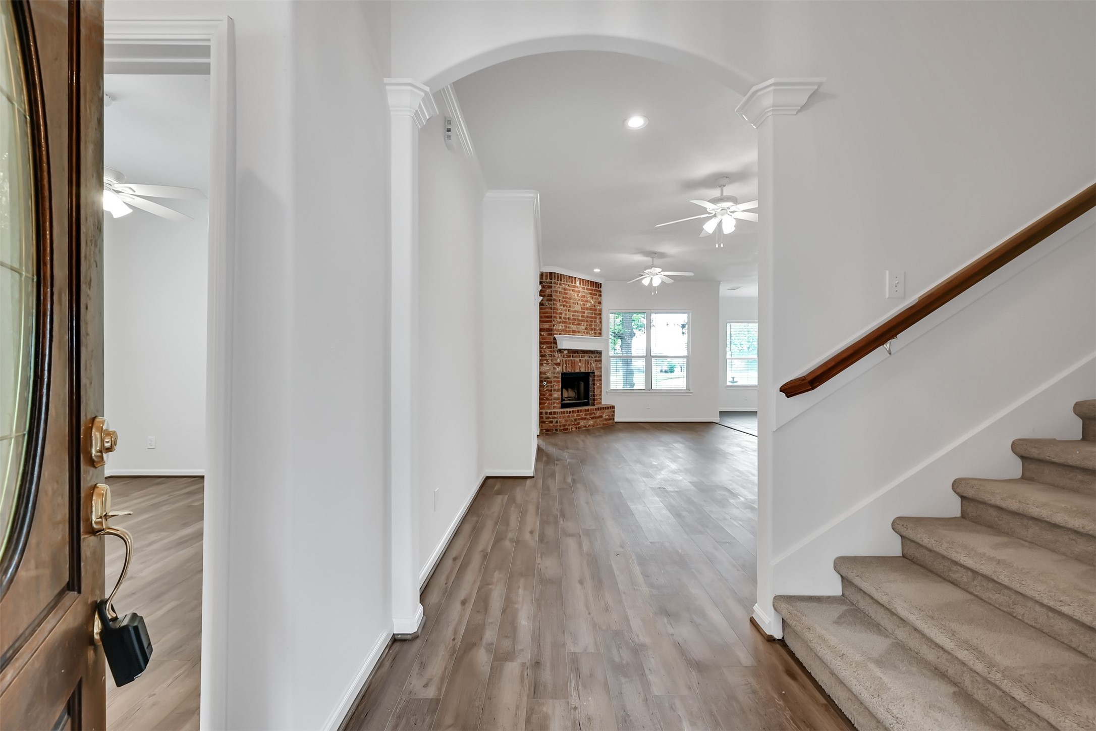 47 Presidio Road Montgomery, TX 77356 - Photo 4 of 35 a view of a hallway with wooden floor and staircase