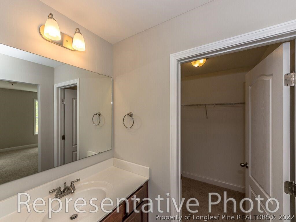 4141 McBryde Road Linden, NC 28356 - Photo 24 of 28 a bathroom with a sink and a mirror
