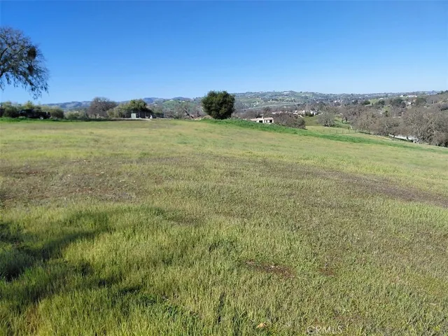 a view of a lake with houses in the back