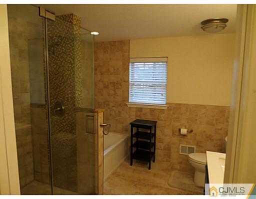 414 New Market Road Dunellen, NJ 08812 - Photo 14 of 25 a bathroom with a shower