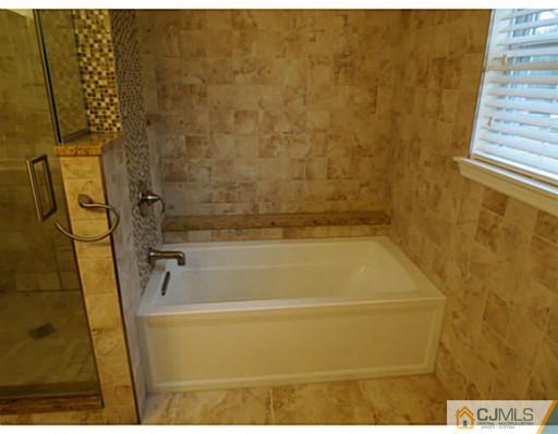 414 New Market Road Dunellen, NJ 08812 - Photo 16 of 25 a bathroom with a shower
