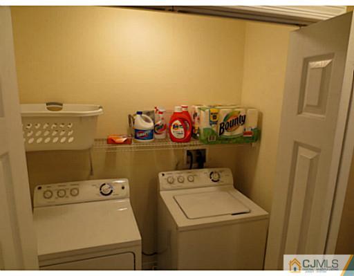414 New Market Road Dunellen, NJ 08812 - Photo 23 of 25 a utility room with dryer and washer