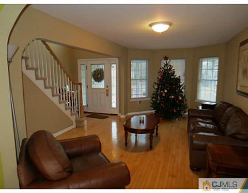 414 New Market Road Dunellen, NJ 08812 - Photo 4 of 25 a living room with furniture and a potted plant