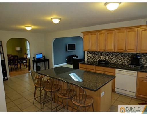 414 New Market Road Dunellen, NJ 08812 - Photo 8 of 25 a kitchen with a sink and cabinets