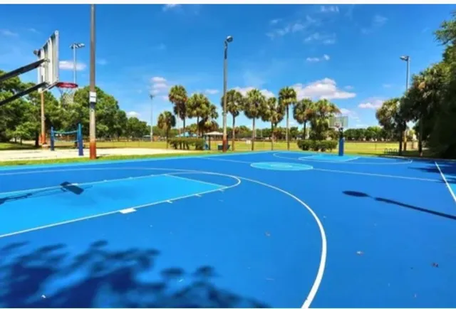 a view of a lake with houses in the background