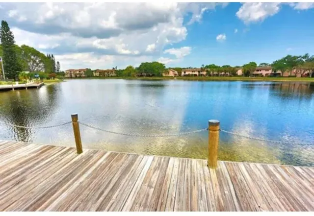 a view of a lake with a yard