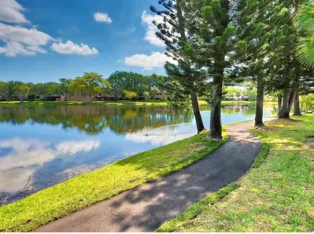 a view of a playground and basketball court