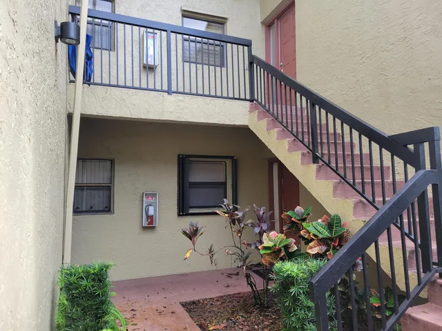 a view of entryway with flower pots
