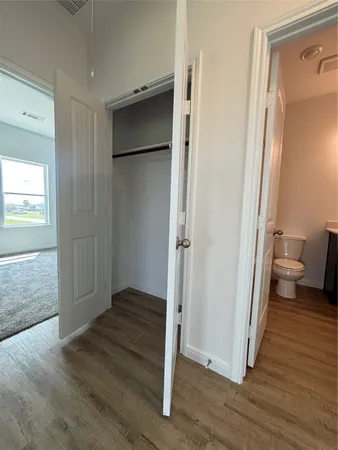 a room with a sink and a mirror