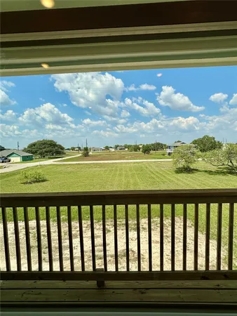 a view of balcony with wooden floor