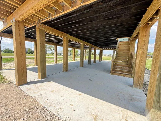 a large kitchen with stainless steel appliances kitchen island a large counter top a sink and a stove