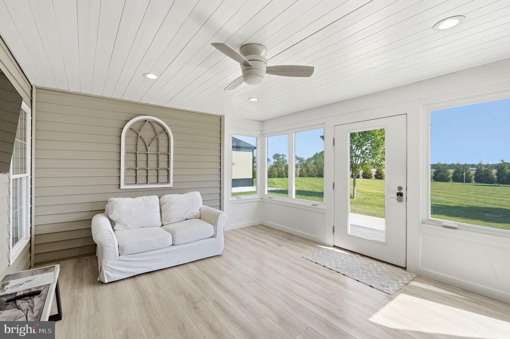 615 Ell Downes Road Henderson, MD 21640 - Photo 15 of 58 Bright and airy sunroom retreat.