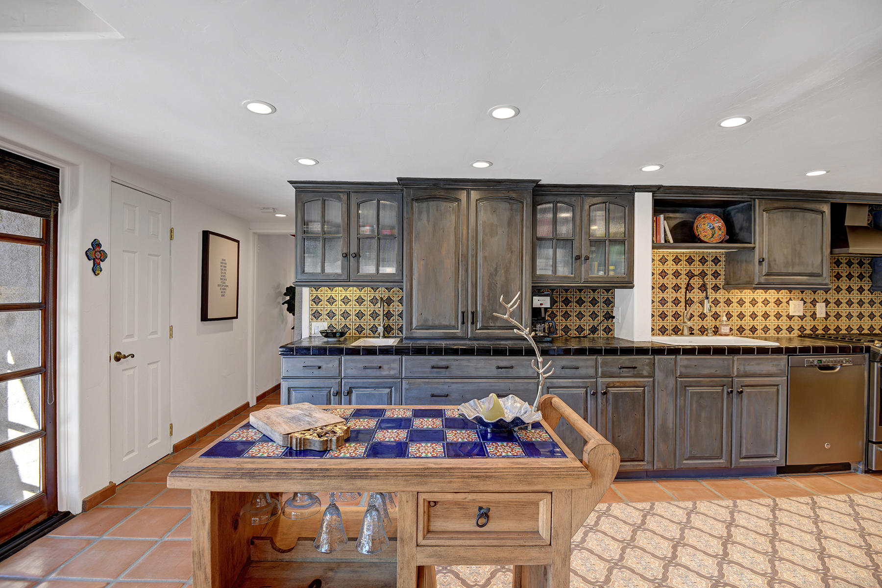 71677 Tunis Road Rancho Mirage, CA 92270 - Photo 13 of 37 a kitchen with stainless steel appliances granite countertop a stove and cabinets